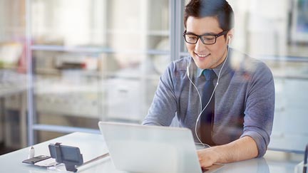 A college student watching a recorded video conference