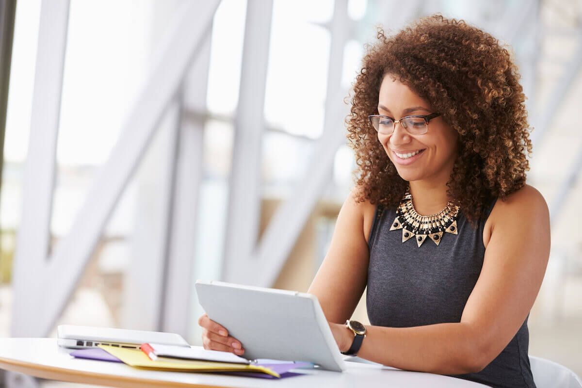 Businesswoman makes online conference call on device